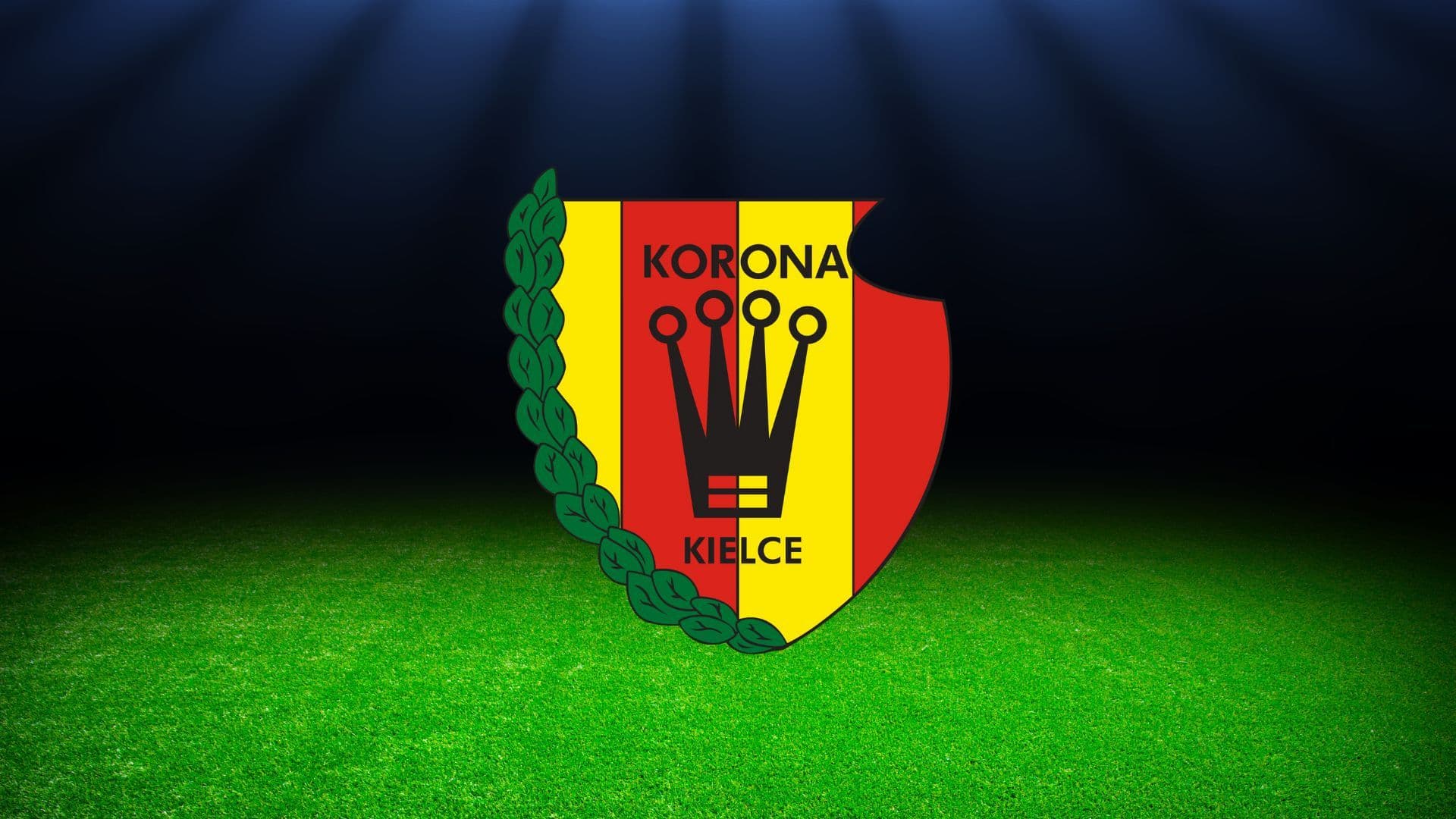 herb korony kielce na tle stadionu